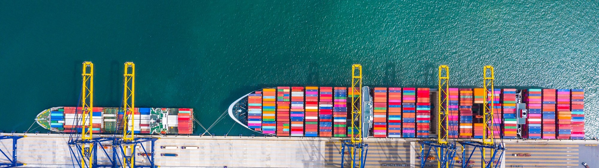 A view of a colourful container ship from above